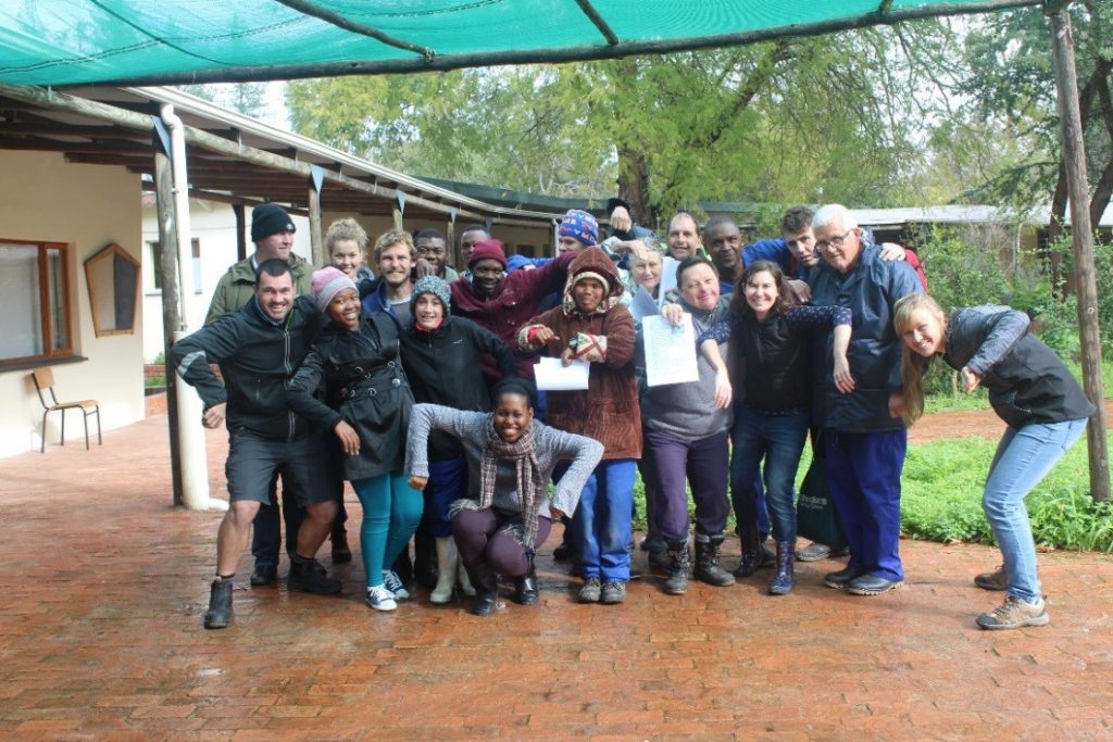 Camphill residents having fun with the Iimbovane project team and mimicking ants showing off their antennas