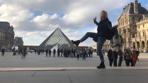 Louise outside the Louvre museum in Paris, France