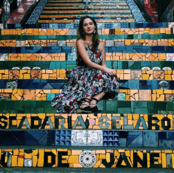 Danielle sitting on the Escadaria Selarón