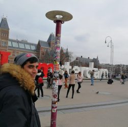 Ryan posing by the 'I am Amsterdam sign'