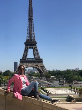 Thoko in Paris in front of the Eiffel Tower