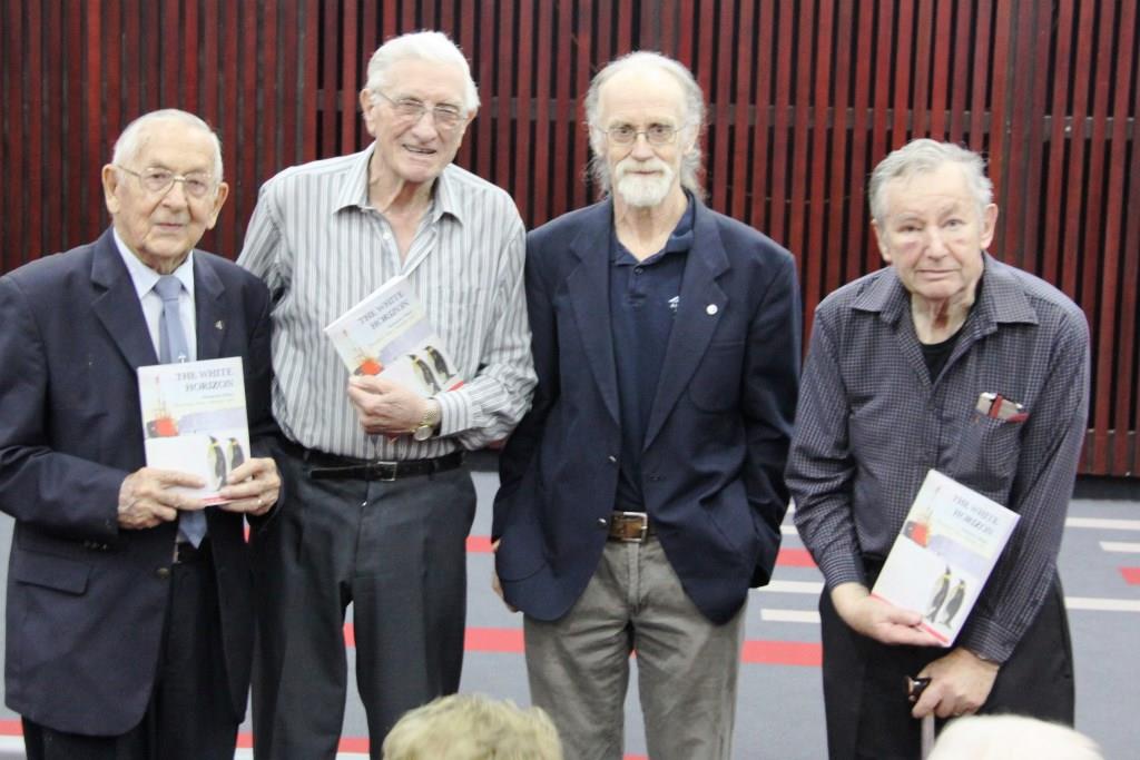 John Cooper presented a copy of The White Horizon to the three remaining team members of SANAE 1 (L-R: Marten du Preez, Chris de Weerdt and Theo van Wijk).  