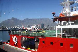 S.A. Agulhas II docked at the East Pier, Table Bay Harbour, with Table Mountain in the back. 