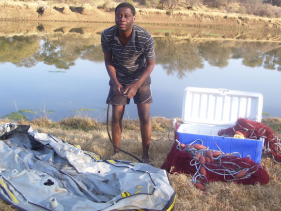 Tsungai Zengeya preparing for field work in the Limpopo River, South Africa