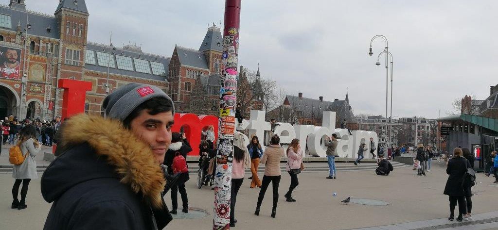 Ryan posing by the 'I am Amsterdam sign'